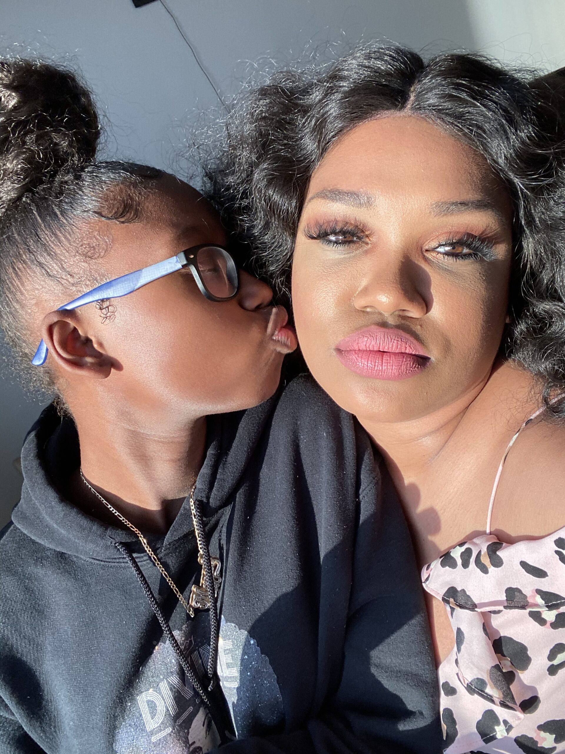 Jay Blessed being kissed by her teenage daughter Maya aka Mimi Blessed. 