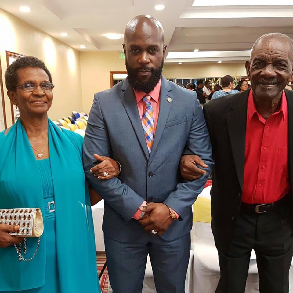 Bunji Garlin flanked his mother and father, Eric Benn, who has just died at 90. Photo credit: EbuzzTT. 