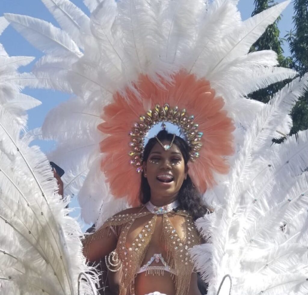 Jay Blessed in full costume during West Indian Carnival Labor Day Parade 2018. Costume by Exotica Ladies / Sesame Flyers